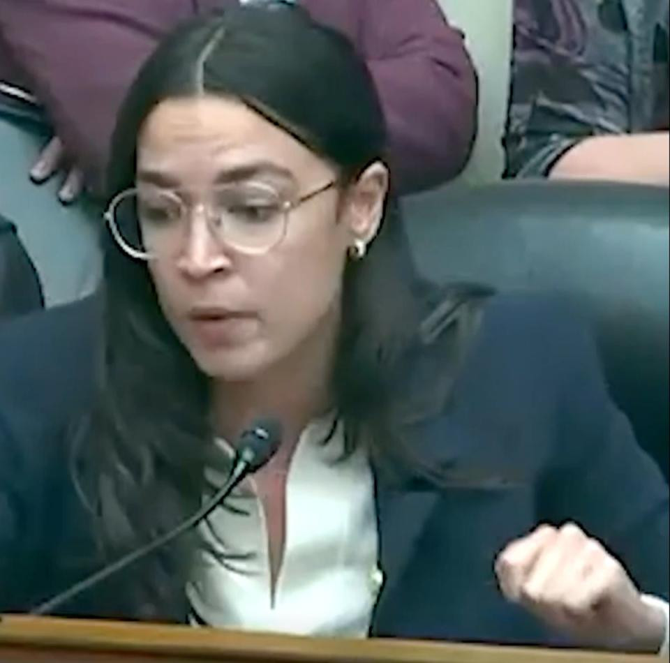 Alexandria Ocasio-Cortez (D-N.Y.) rebukes Marjorie Taylor Greene (R-Ga.) during contentious House Oversight Committee Hearing