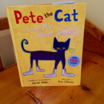 Pete the Cat happily walking in his white shoes