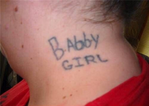 A person pointing and laughing at another person's tattoo