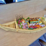 Exquisite sushi boat at Song Lan restaurant in Dublin Ohio showcasing a variety of fresh sushi and sashimi rolls.