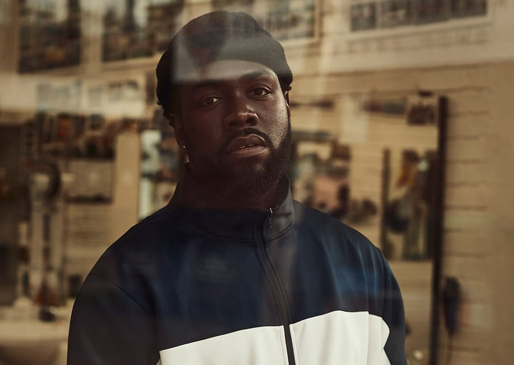 Jake Isaac performing live, conveying the honesty of his music
