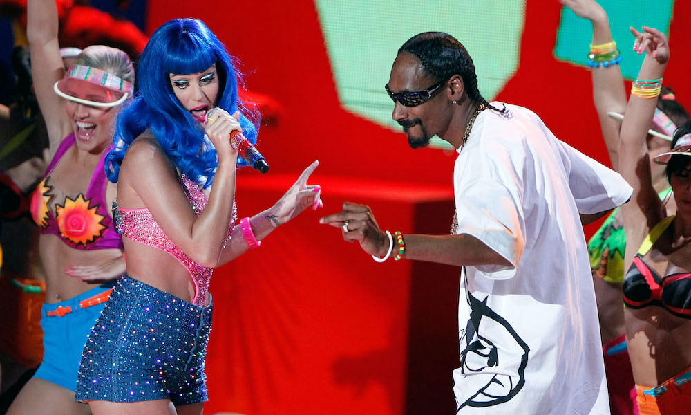 Katy Perry performing on stage with a microphone
