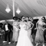 Bride and Groom Enjoying First Dance at Wedding Reception to Popular Wedding Songs
