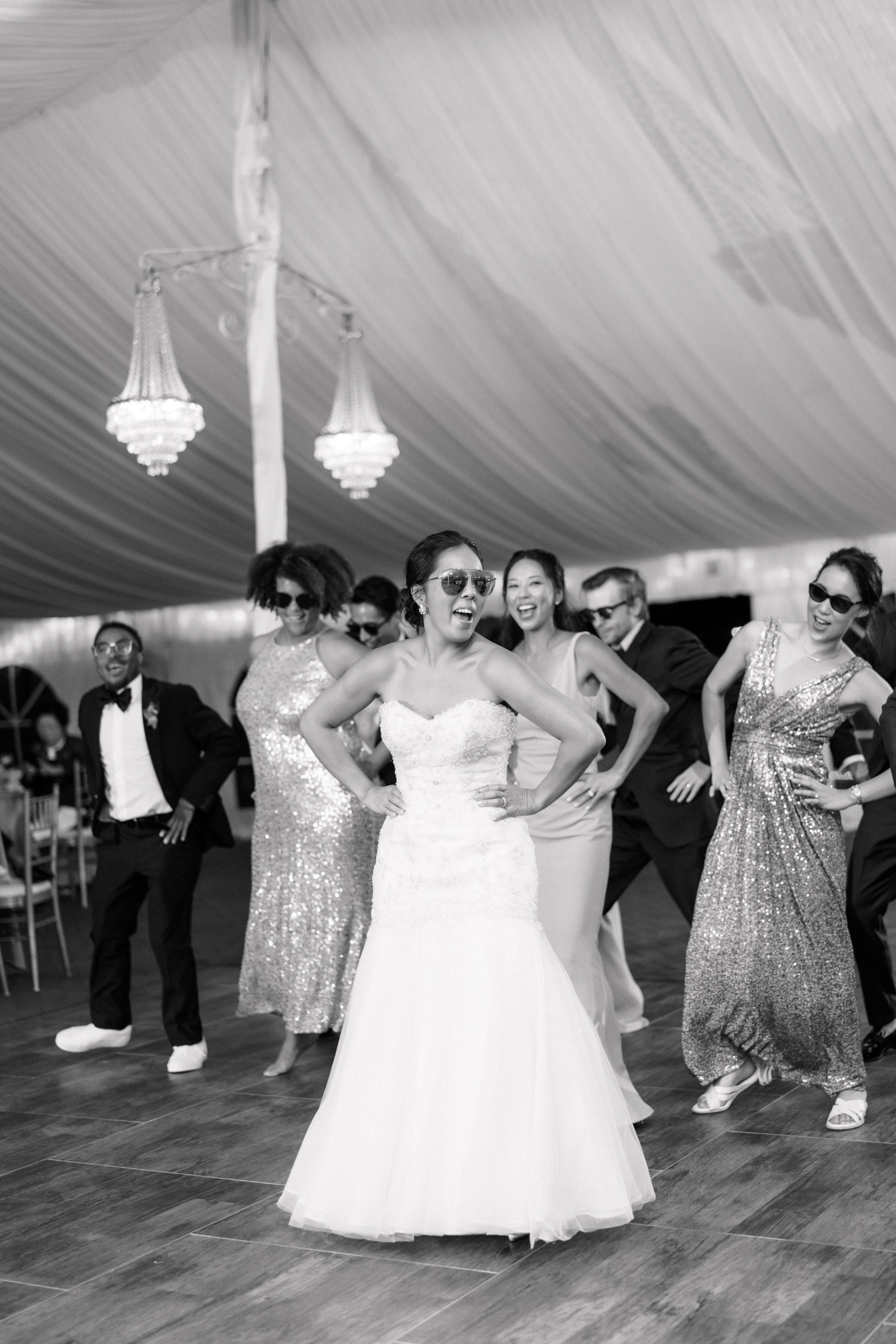 Bride and Groom Enjoying First Dance at Wedding Reception to Popular Wedding Songs