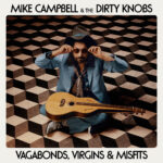 Mike Campbell and The Dirty Knobs performing live, showcasing their energetic rock sound