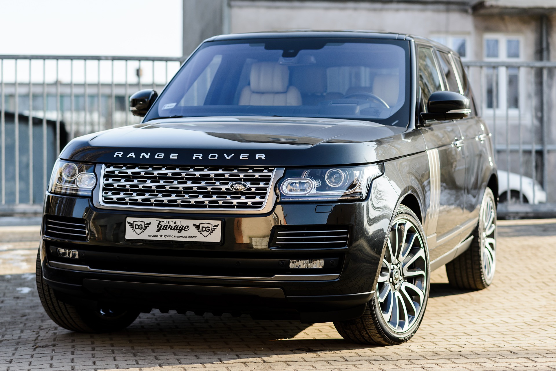 A silver Range Rover parked on a street