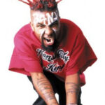Tech N9ne with spiked hair in 2009, showcasing his iconic look from his older era.