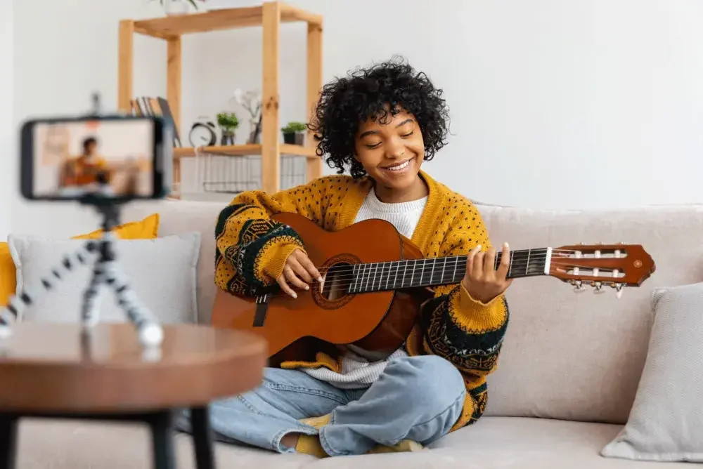 A musician performing a cover song on YouTube, demonstrating the platform's potential for exposure and engagement.
